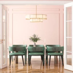 Entrance Of Dining Room With Dining Table, Green Velvet Chairs And Pink Wall In Background