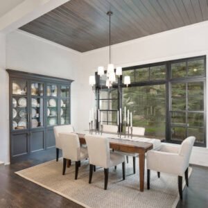 Wonderful built in china cabinet and wood panel ceiling add elegance